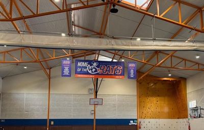 A Large Indoor Basketball Court With a Sign That Says 'basketball' on It — Signworld In Mitchell, ACT