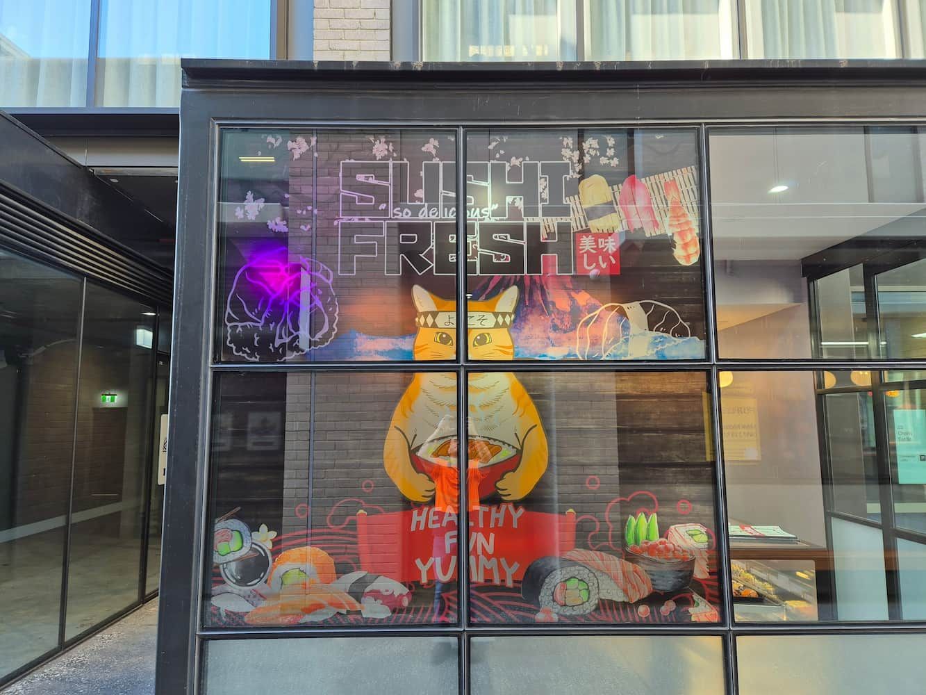 A Restaurant With a Cartoon Character on the Window — Signworld In Mitchell, ACT