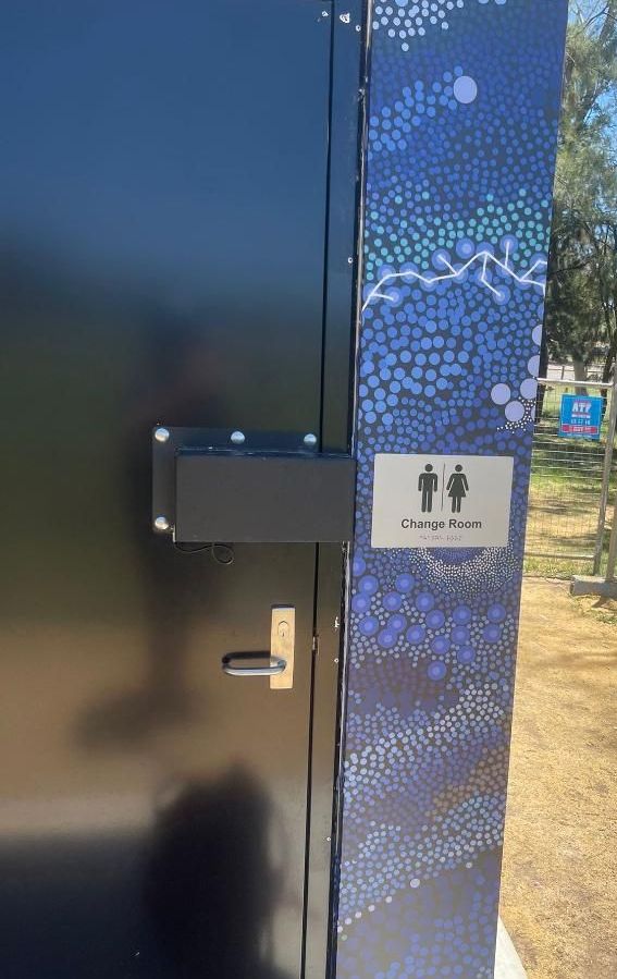A Blue Door With a Sign on It That Says Toilets — Signworld In Mitchell, ACT