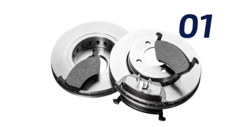 A pair of brake pads and a brake disc on a white background. | Keck's Repair Inc
