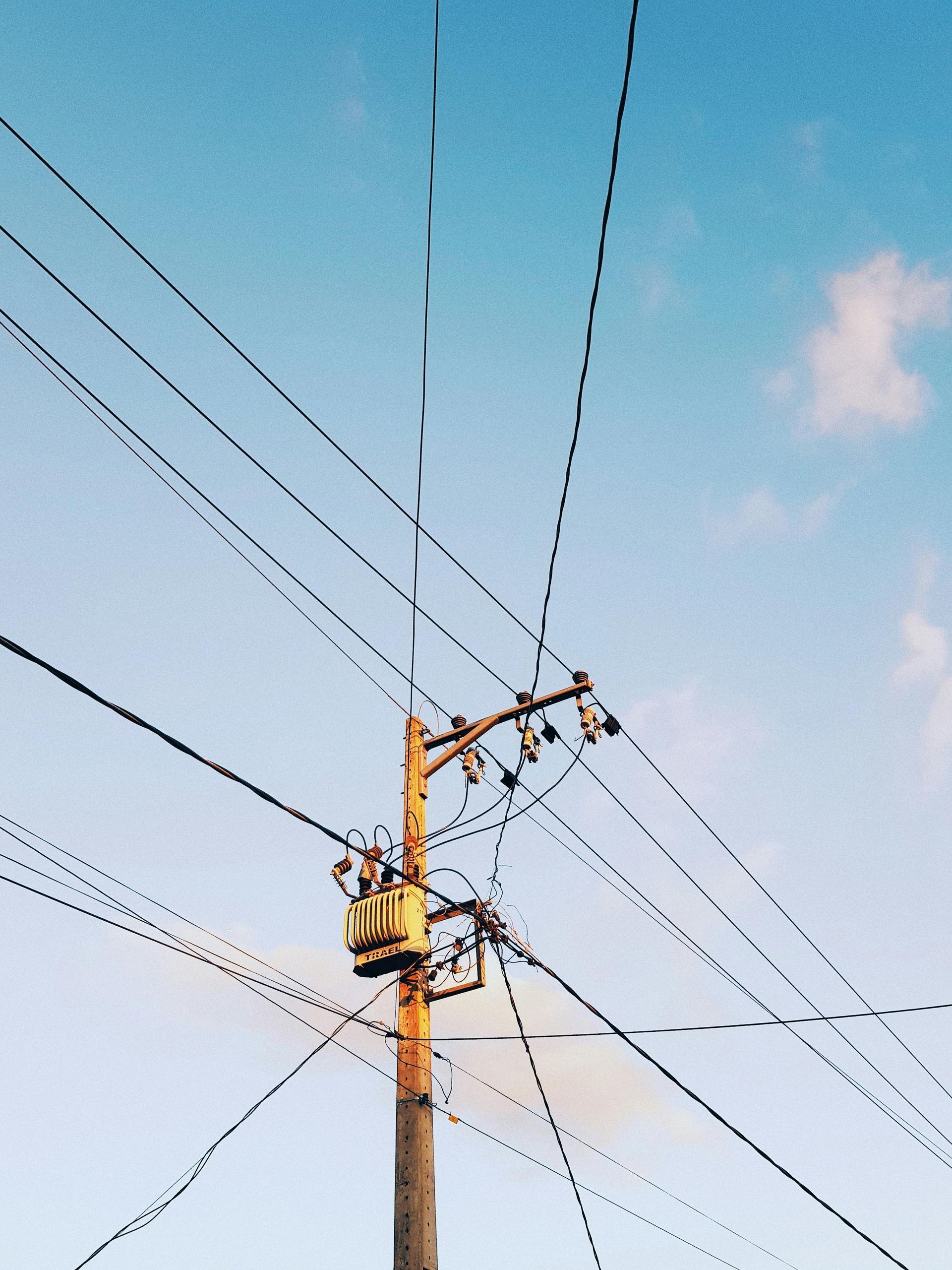 Utility maintenance workers inspecting power and telecommunications lines in Oregon