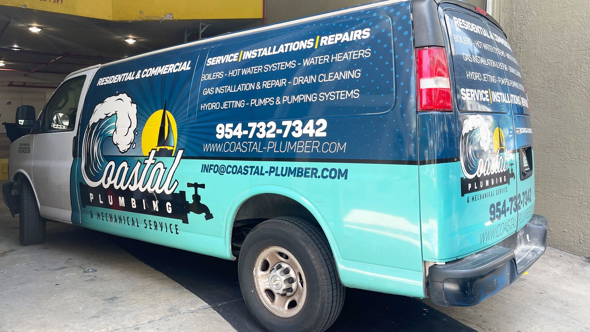 A person is pouring water from a faucet into a sink.