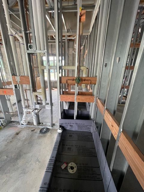 A bathtub with a shower head attached to it in a bathroom.