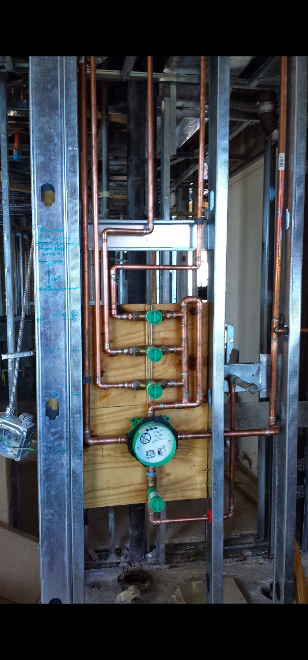 A person is pouring water from a faucet into a sink.