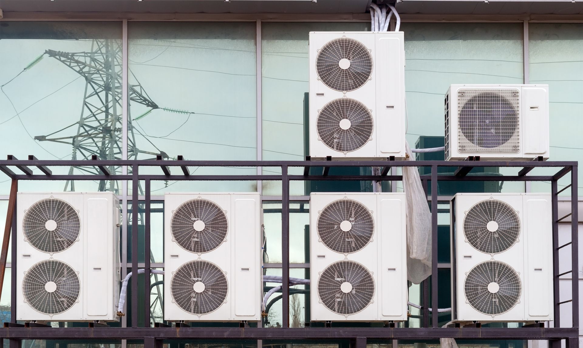 A man is working on a valve in a factory.