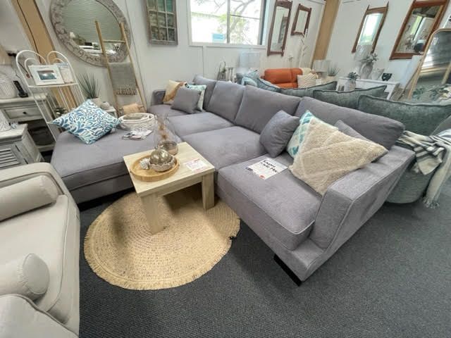 A living room filled with furniture and a couch.