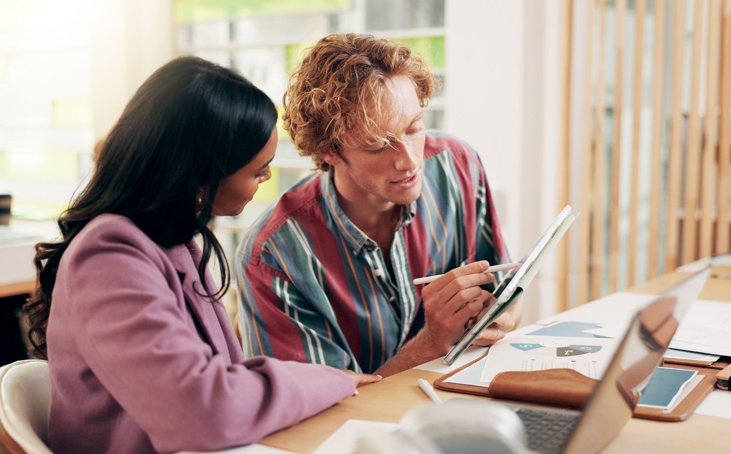 Support Worker helps Participant in their work.