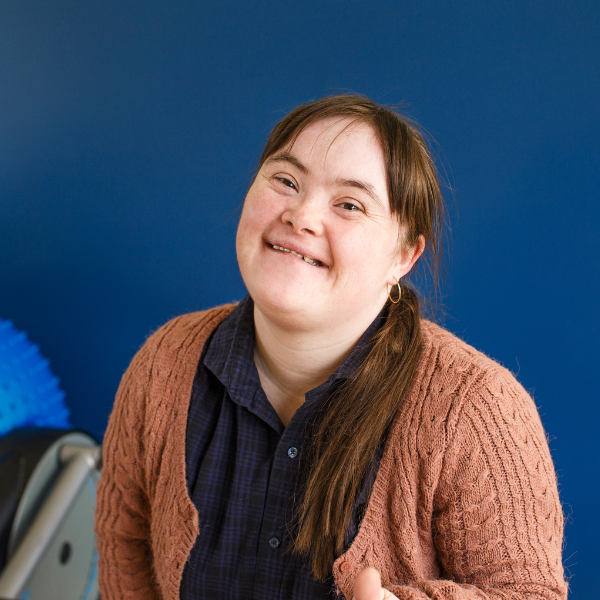 Woman with disability smiling at camera