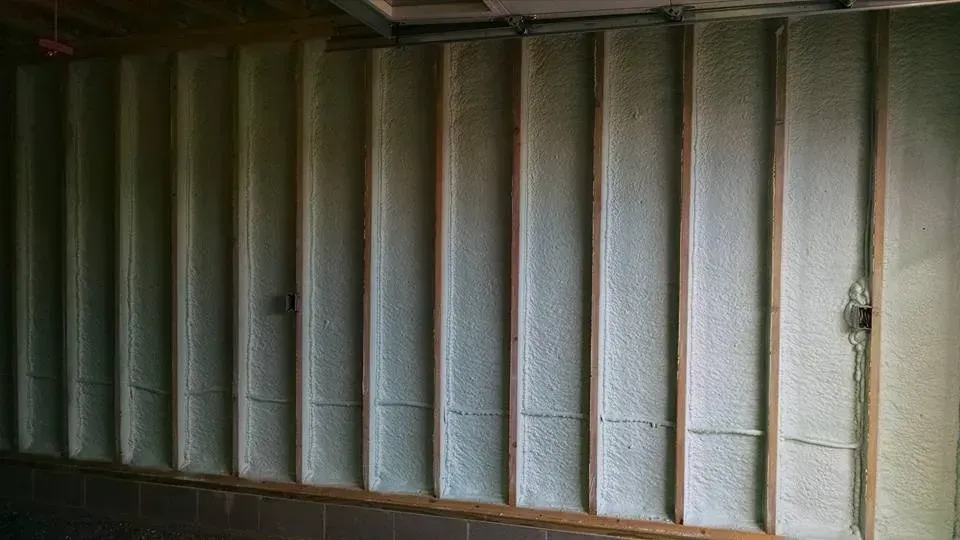 A wall with a lot of foam on it in a room.