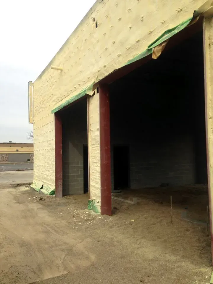 A building with a lot of doors and a lot of foam on it