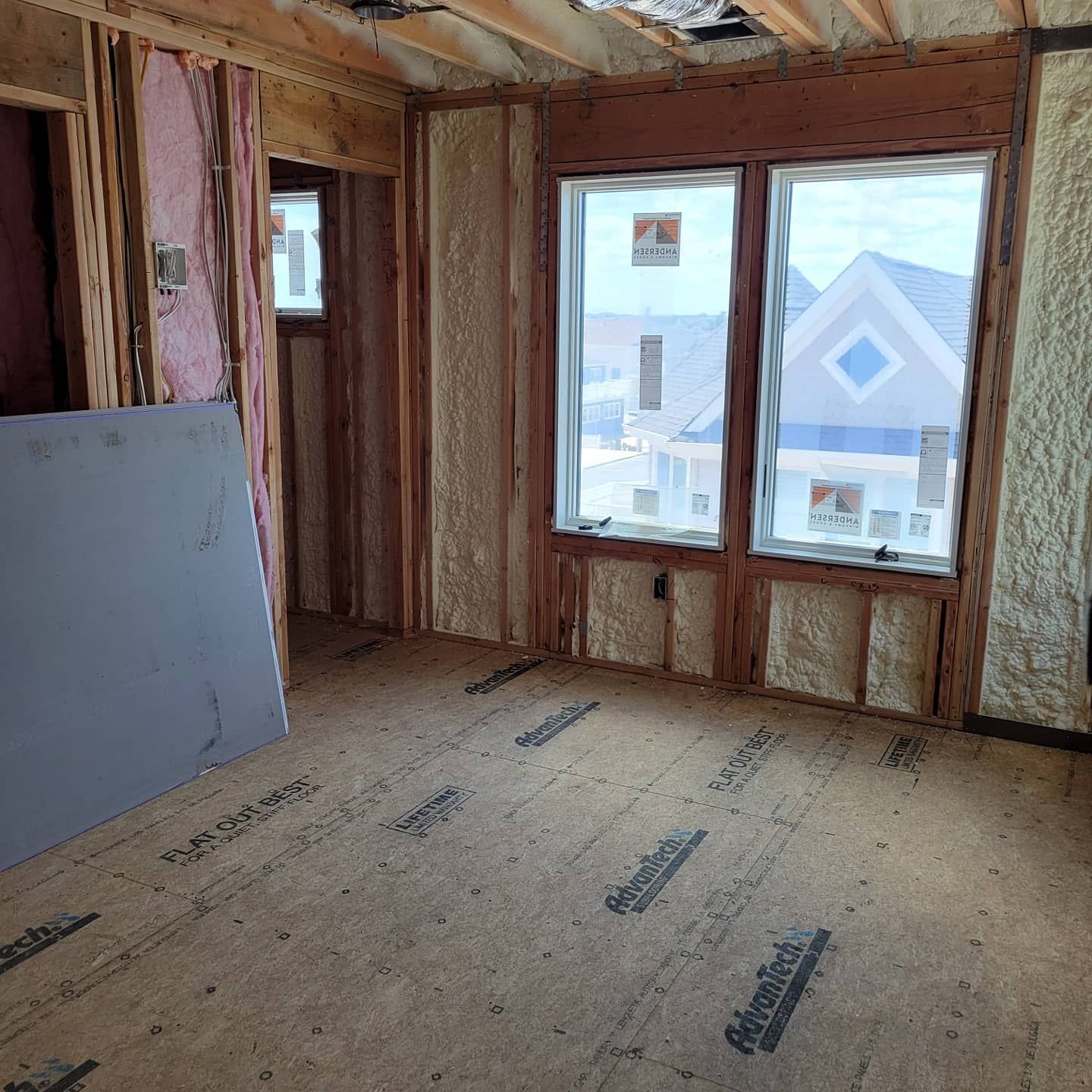 A room with a lot of windows and foam on the walls.