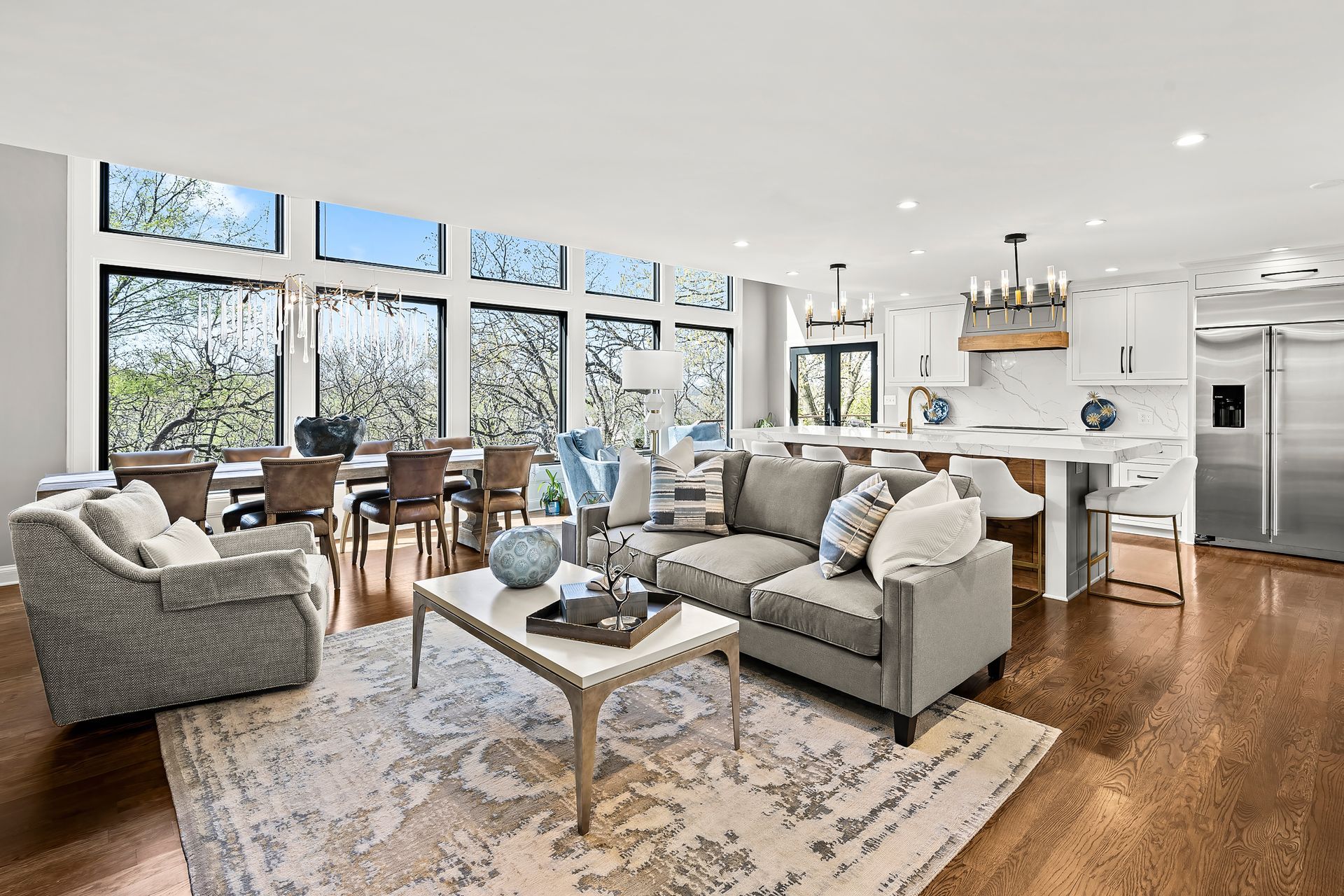 Remodeled living room with large windows by Gartman Remodeling in Kansas City