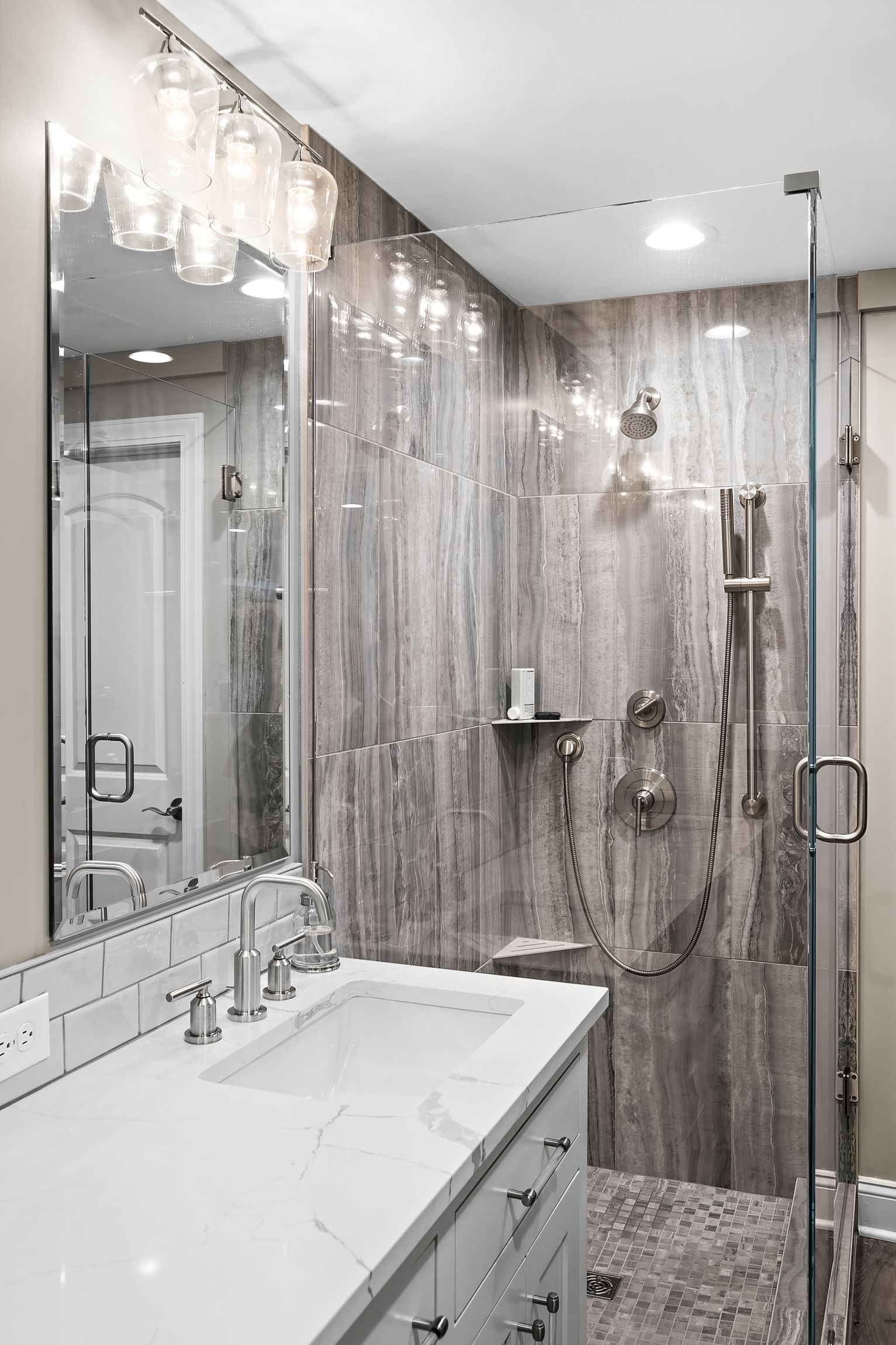 Remodeled shower and sink by Gartman Remodeling in Kansas City