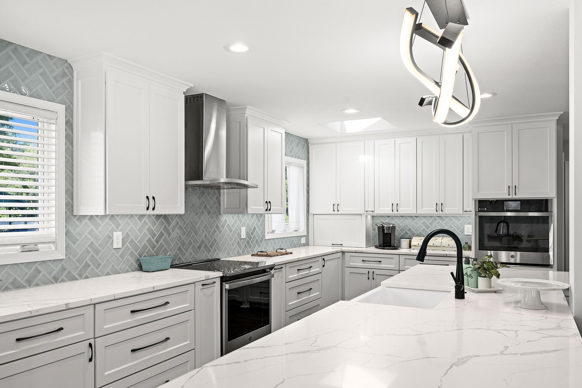 Remodeled kitchen with white counter tops by Gartman Remodeling in Kansas City