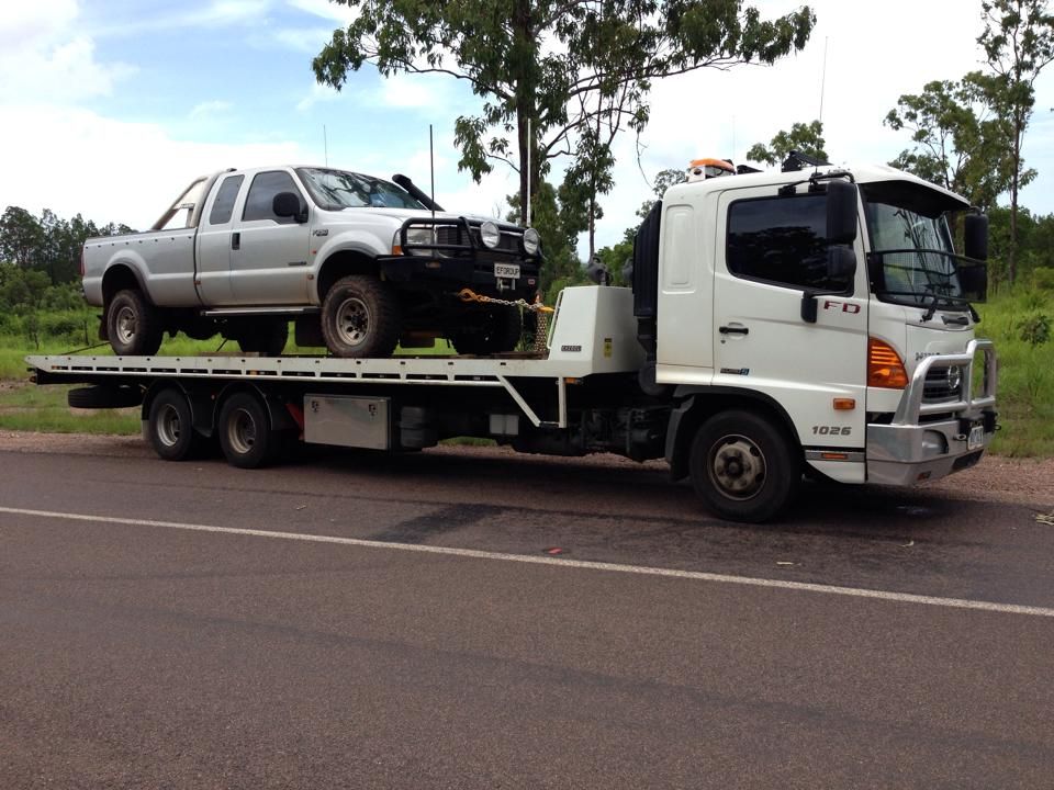 A Tow Truck is Carrying Two Pickup Trucks on Its Flatbed — Cohen’s Towing & 4WD Recoveries In Alice Springs, NT