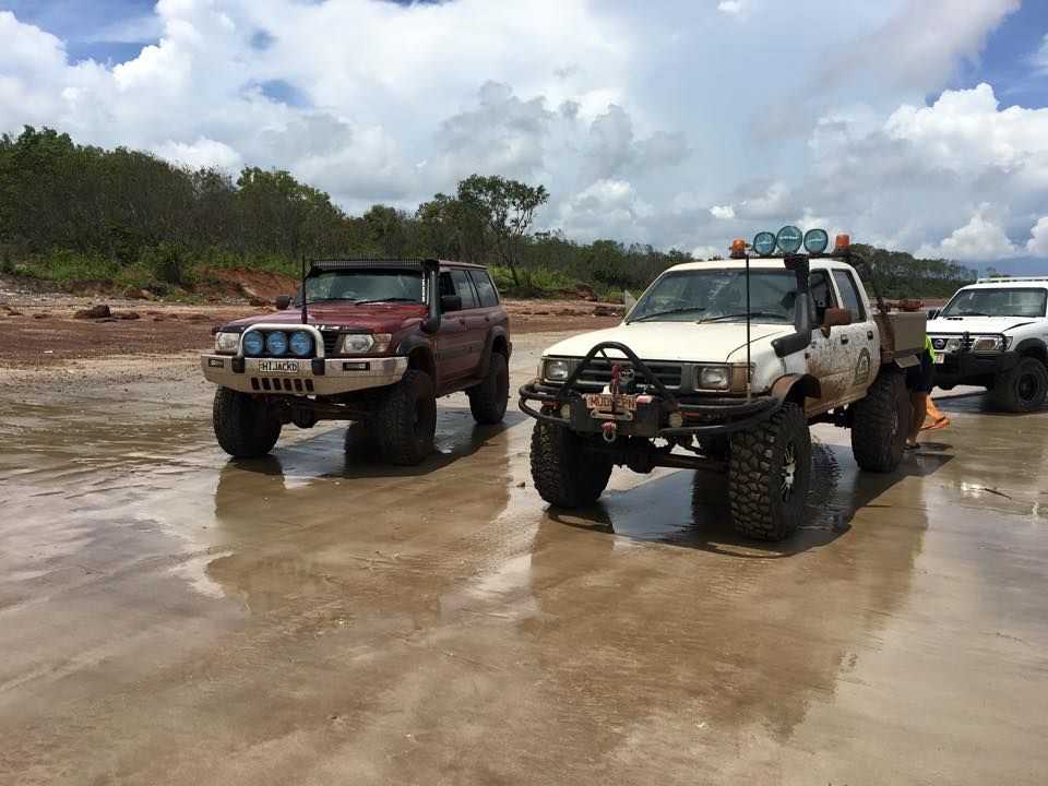 Two Trucks Are Parked Next to Each Other in a Muddy Area — Cohen’s Towing & 4WD Recoveries In Katherine, NT