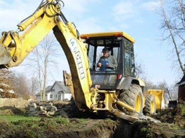 A-1 Contractor Operating An Excavator — Sewer Installation in Fort Wayne, IN