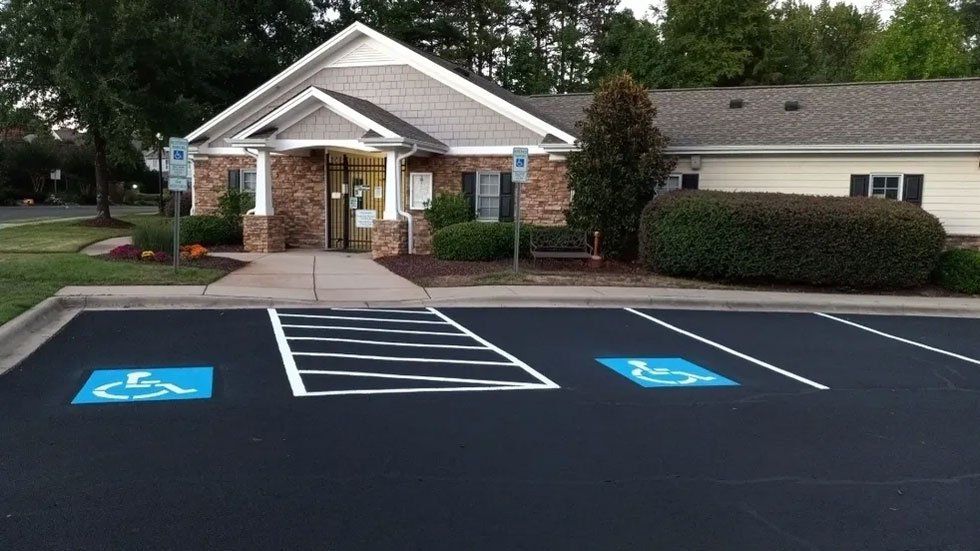 A handicapped parking spot in front of a building