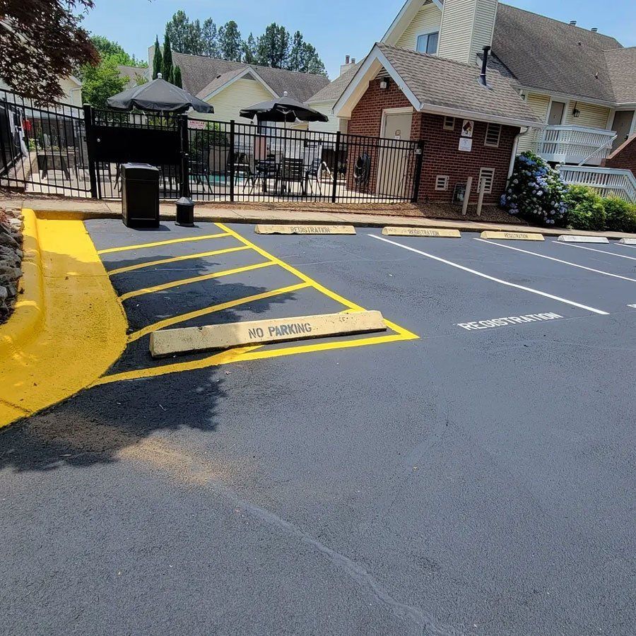 A parking lot with a yellow line that says no parking