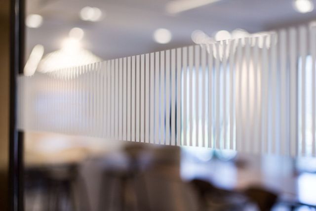 a blurry picture of a room with a striped wall .