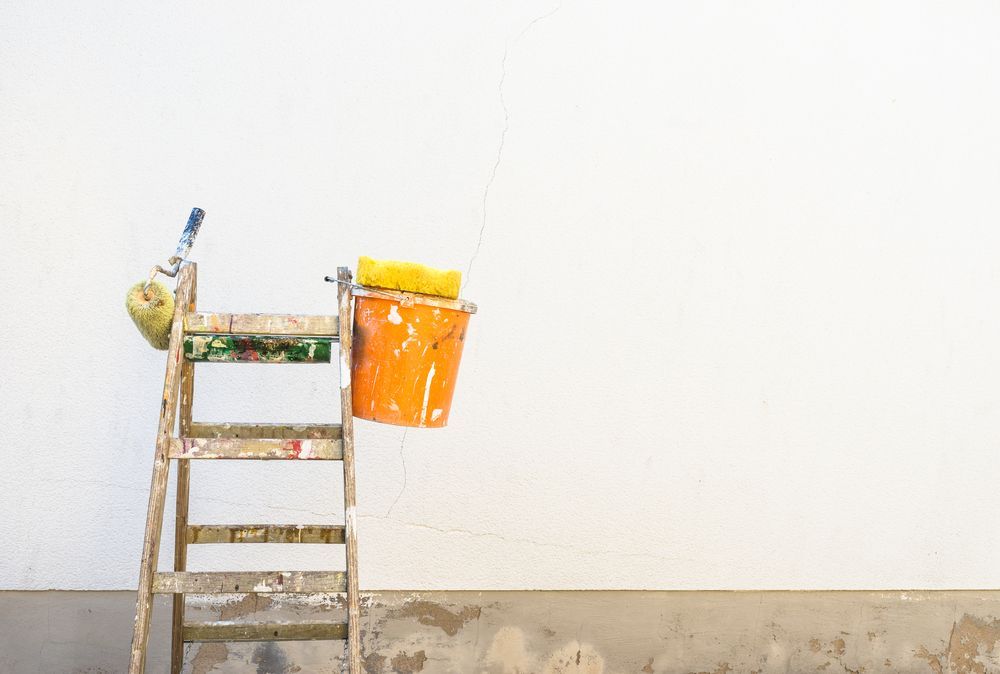 Wooden Ladder Propped Against a White Wall — G.N Painting and Decorating in Port Macquarie, NSW