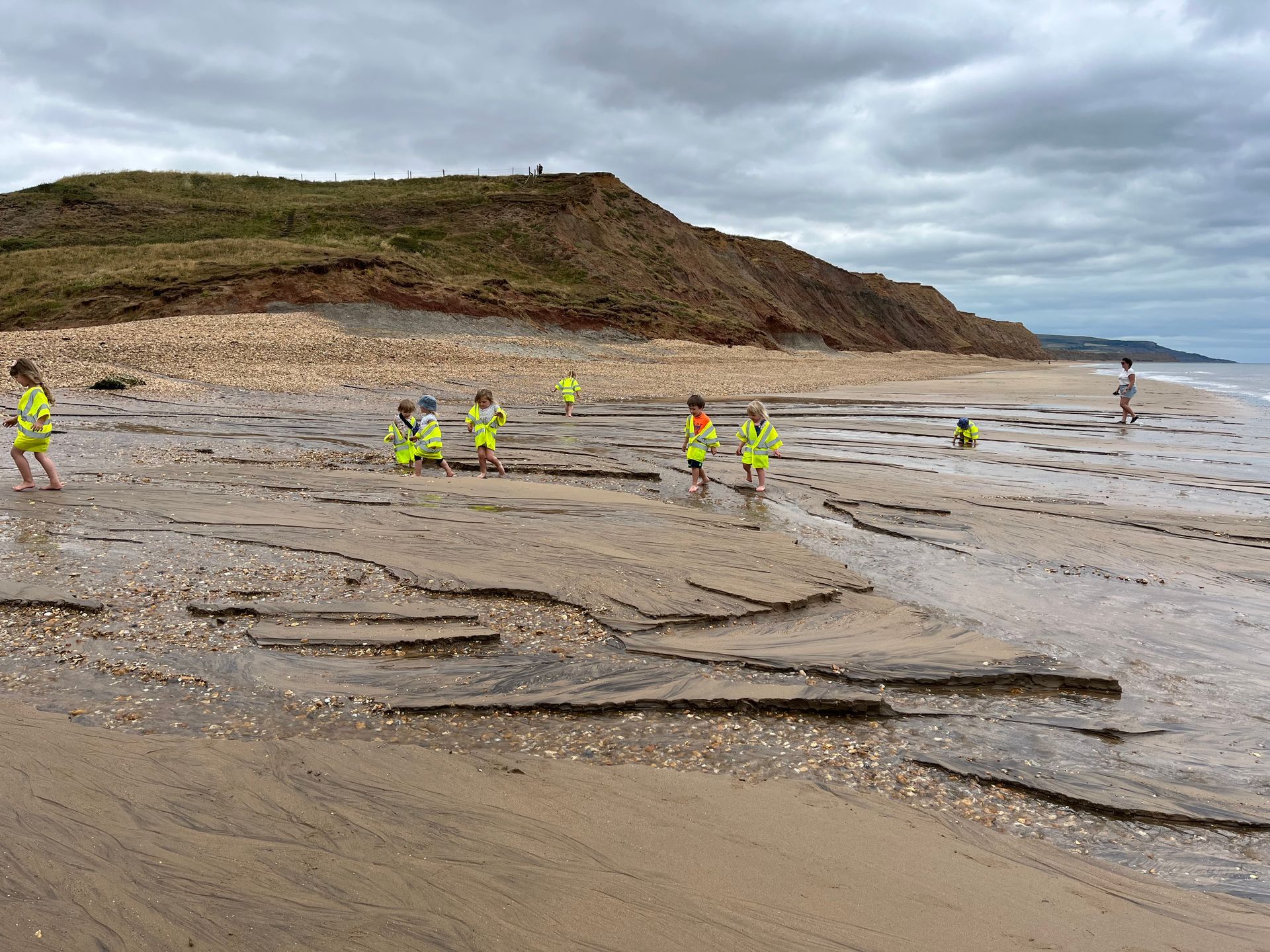 A group of children are playing on a beach.