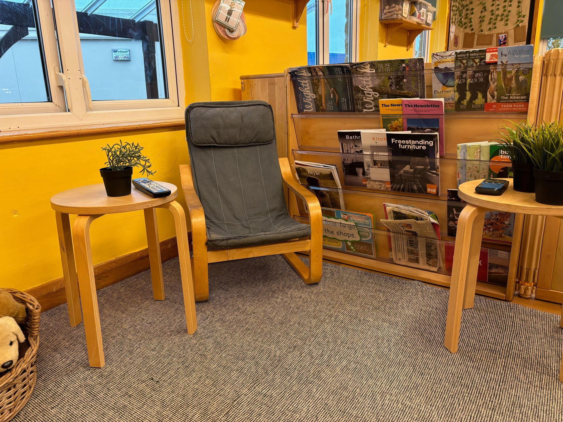 There is a chair and a table in the room.