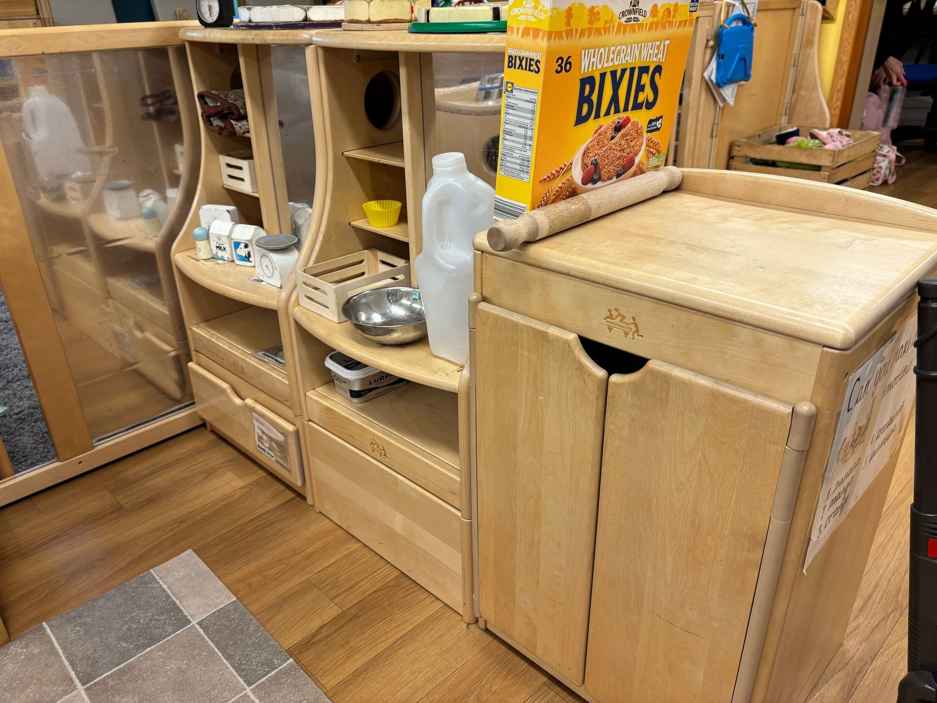 A box of bixies cereal is sitting on top of a wooden counter.