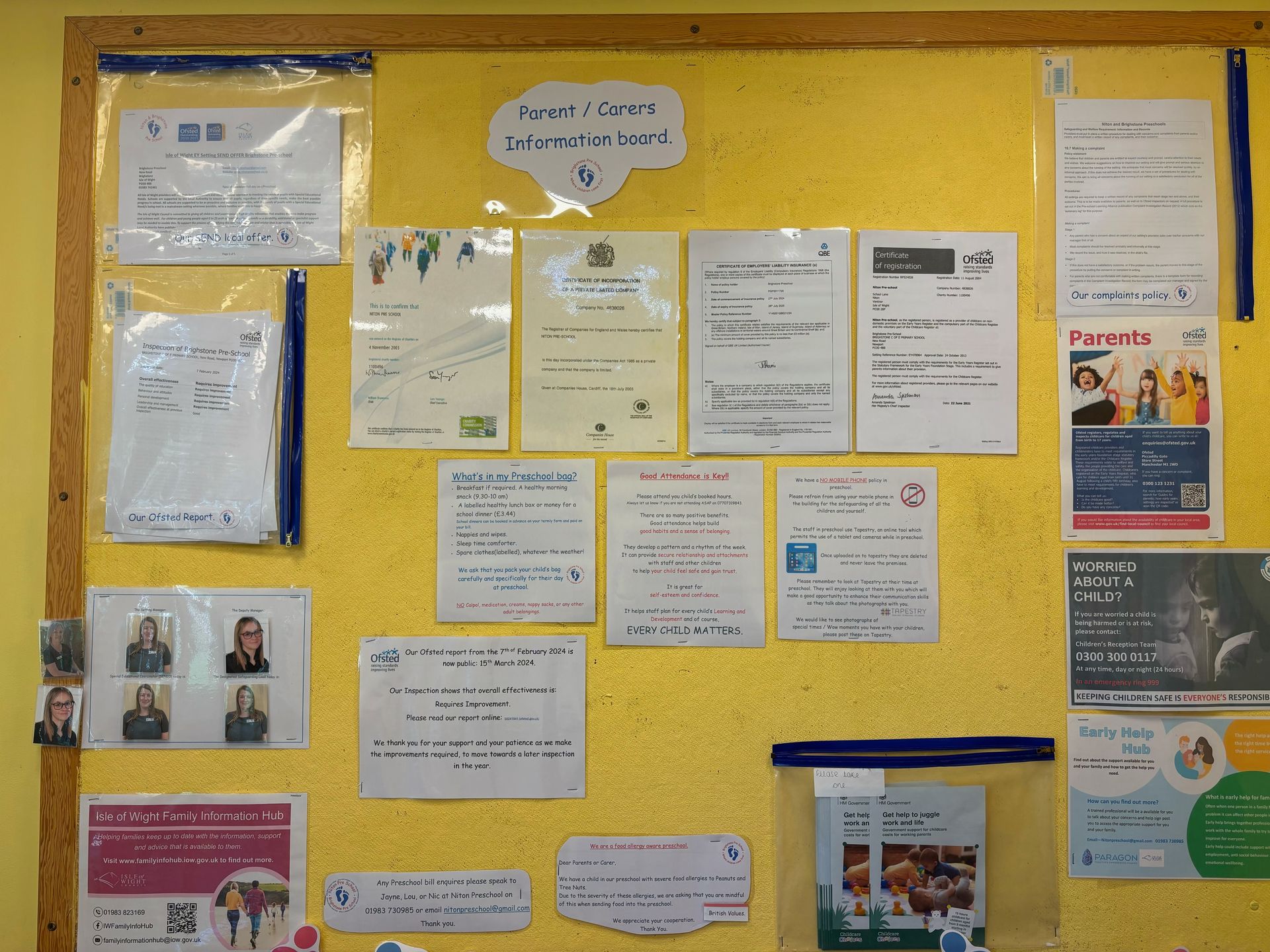 A bulletin board with a lot of papers on it