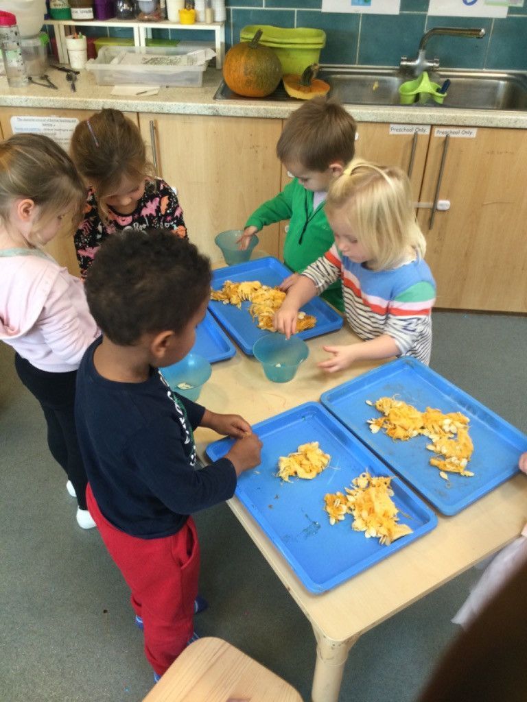 A group of children are playing with food on a table