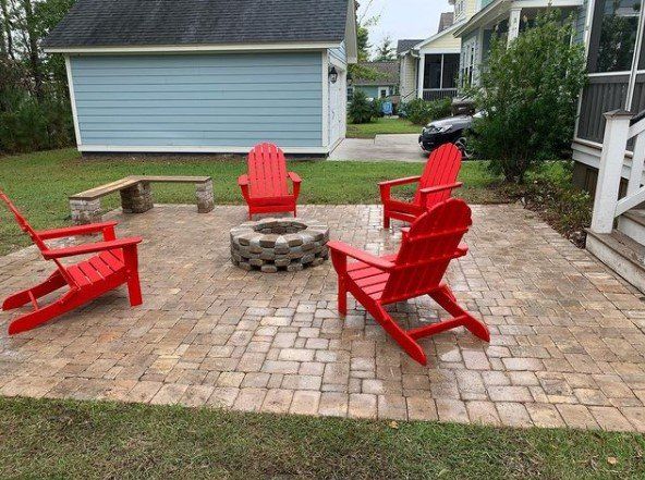Fire Pit with Red Outdoor Chairs — Mount Pleasant, SC — Tidewater Landscape LLC
