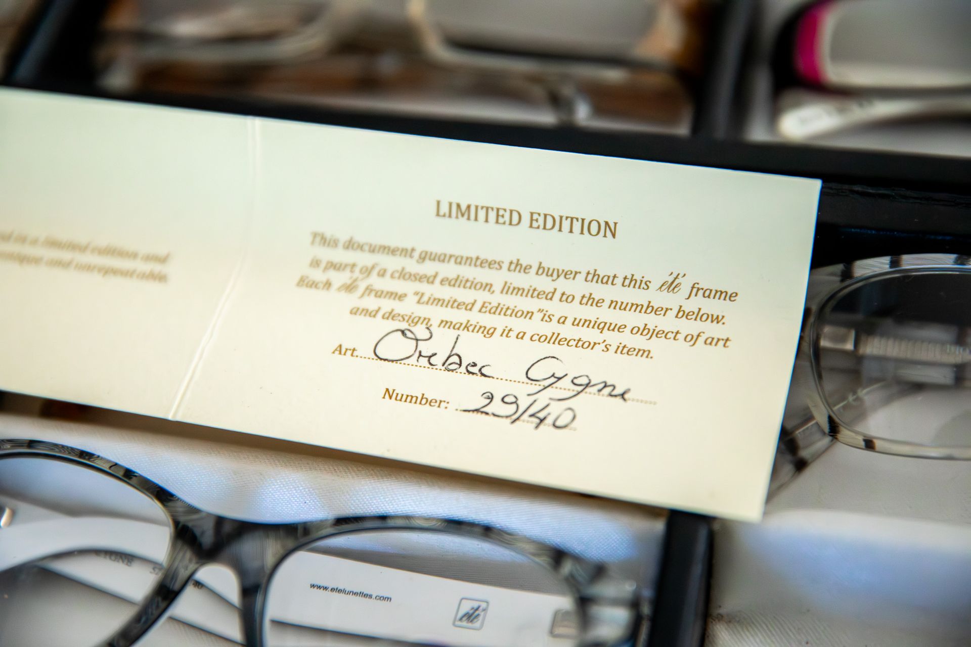 A pair of glasses sitting on top of a piece of paper that says limited edition