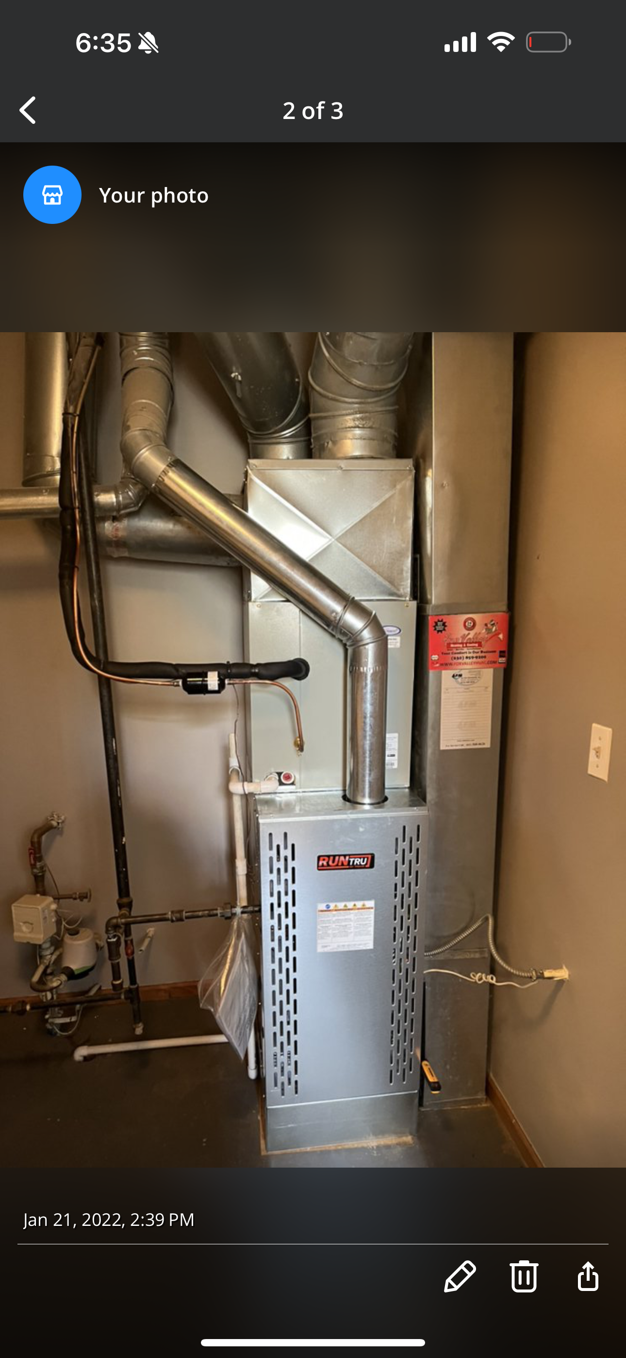 A picture of an air conditioner in a room on a phone.