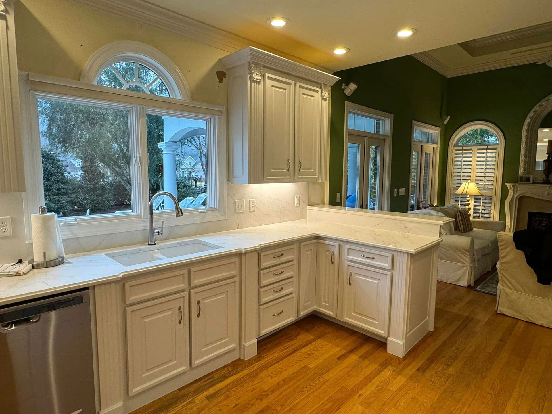 white kitchen with wood floors