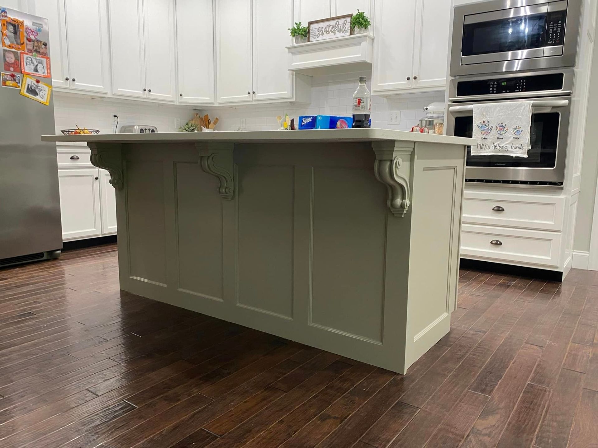 A kitchen with a large island in the middle of it.
