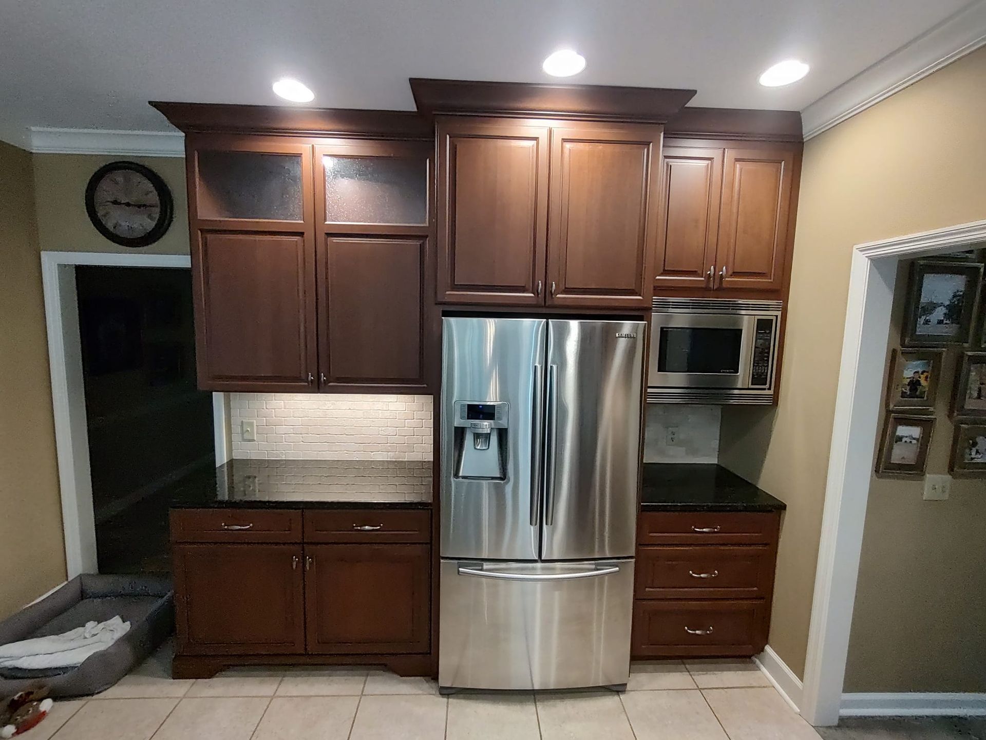 A kitchen with stainless steel appliances and wooden cabinets