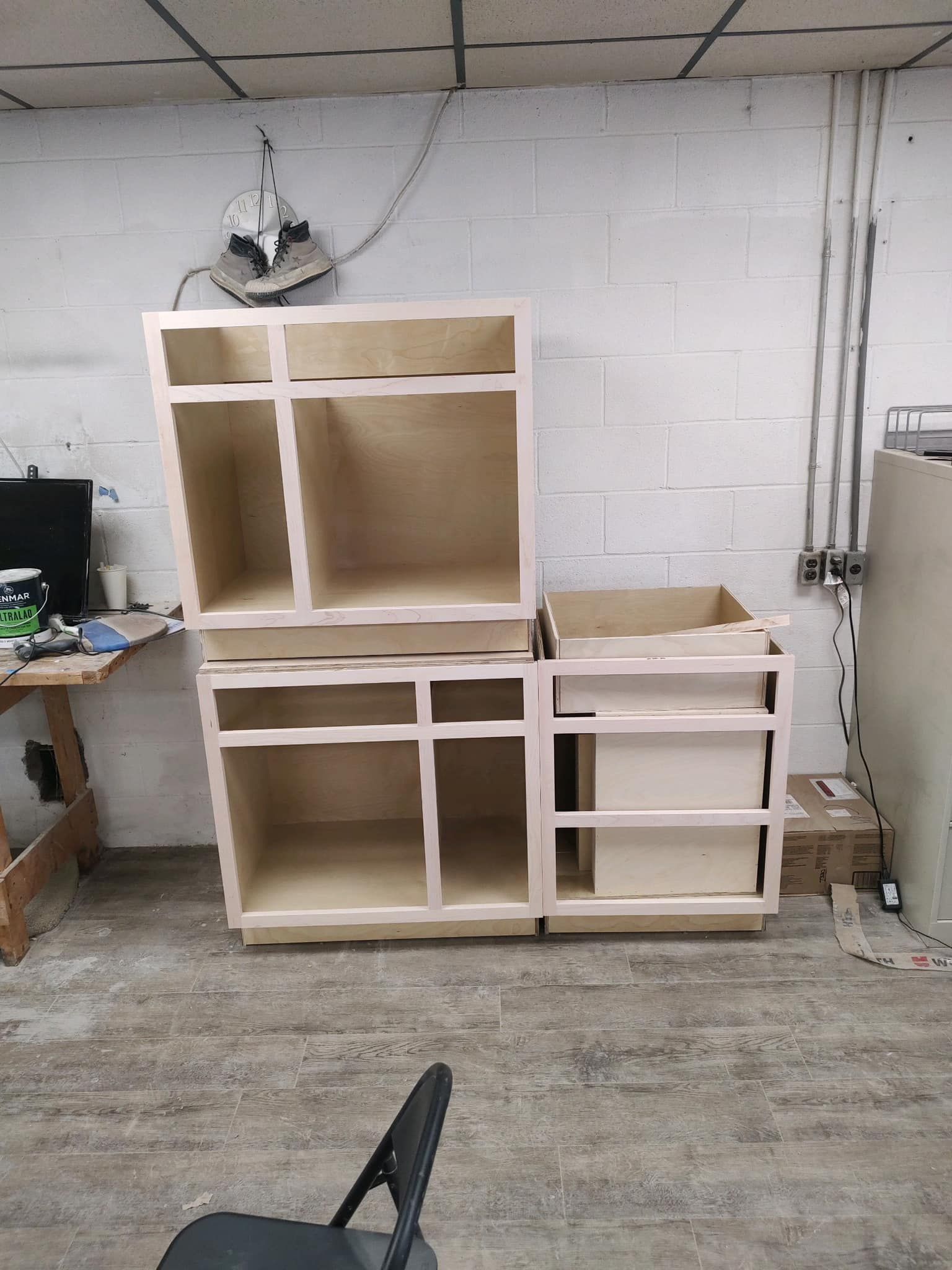 A bunch of cabinets are sitting on top of each other in a room.