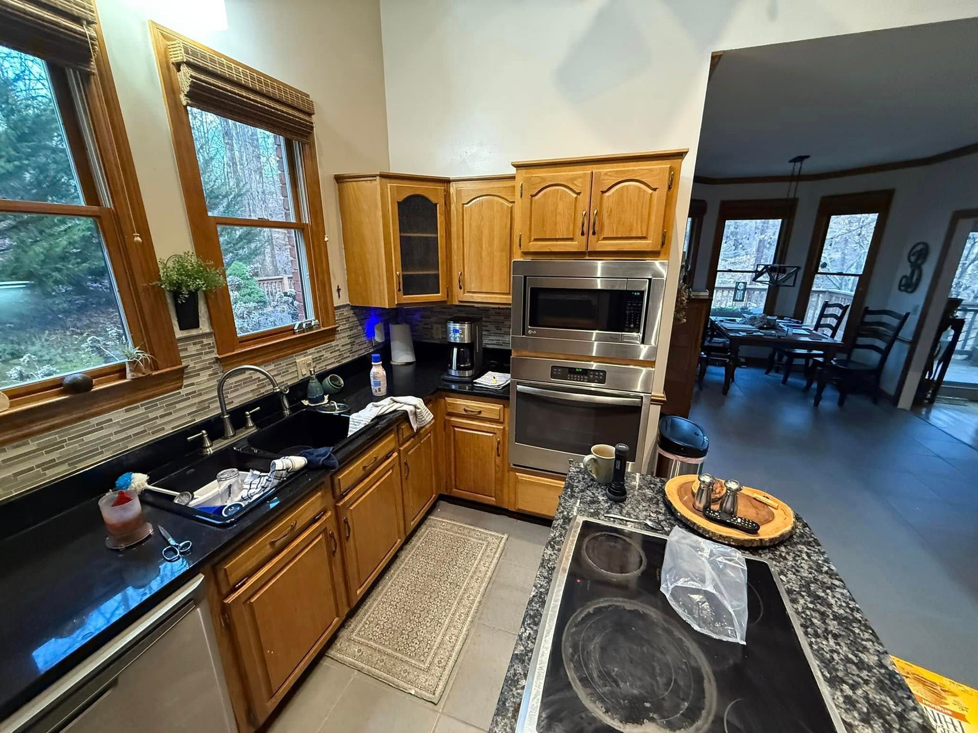 A kitchen with stainless steel appliances and wooden cabinets