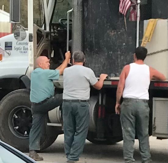 Workers Carrying Septic Tank — Snyder Twp, PA — Ray Burial Vault Co