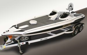White and black bass boat on a trailer, angled view. Gray deck, two seats, and fishing pole holder.