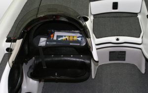 Open boat storage compartments, one with items inside. White and black.