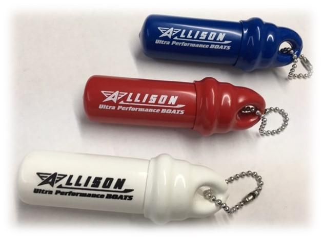 Three cylindrical Allison Ultra Performance Boats keychains: blue, red, and white. Each has a silver chain.