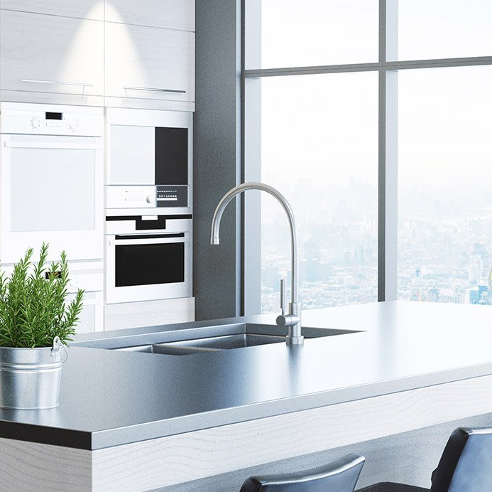 A kitchen with a sink and a large window