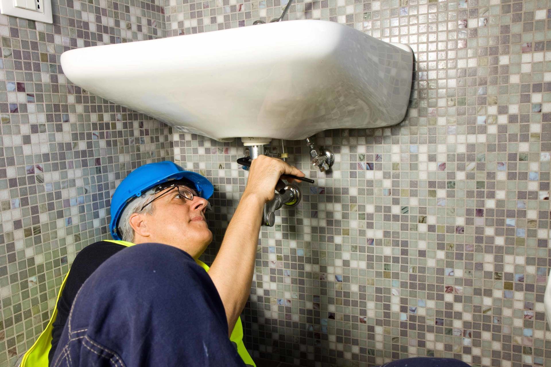 Plumber Fixing a Leak — Beech Grove, IN — Preferred Mechanical Services