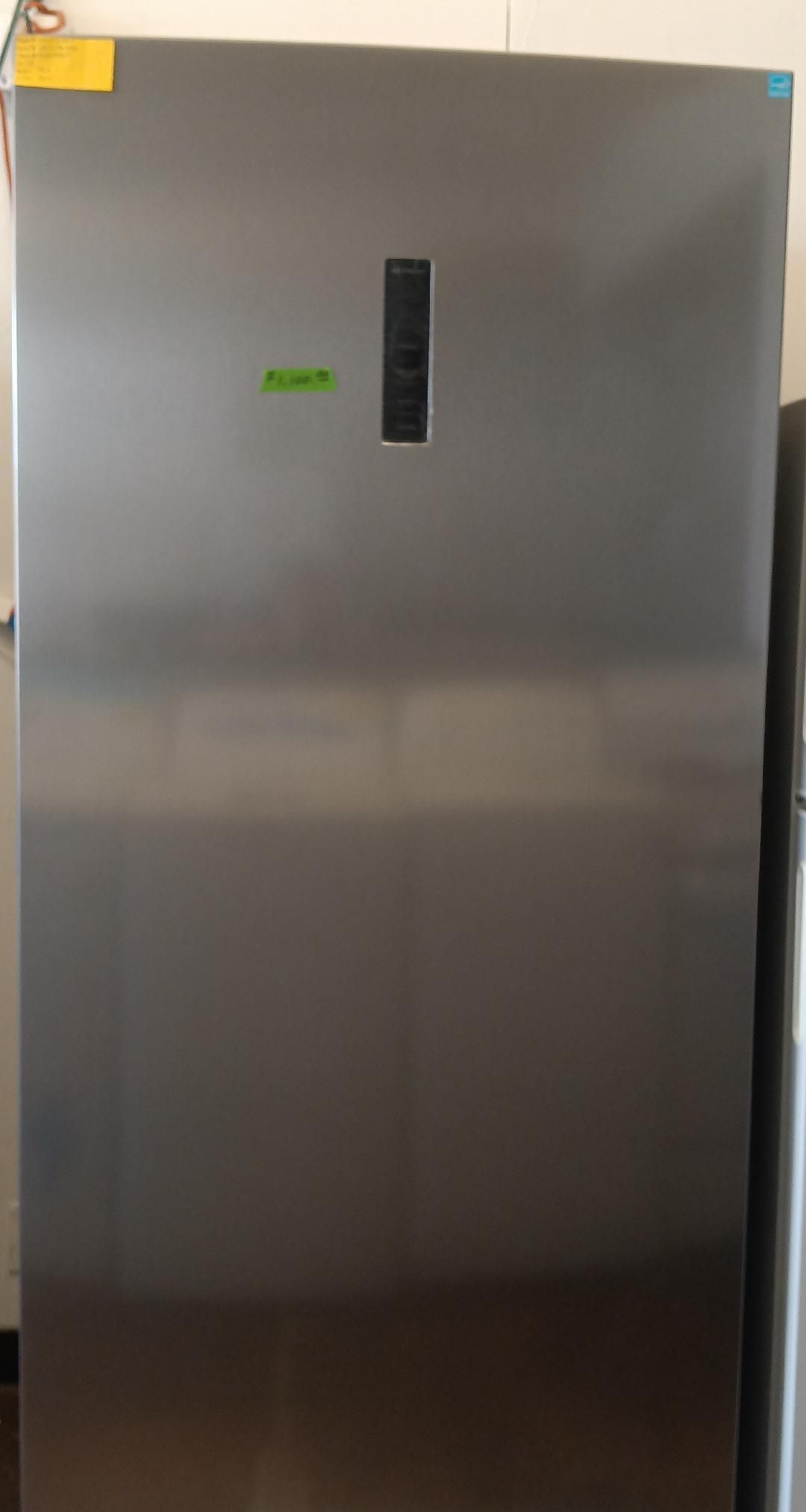 A stainless steel upright freezer