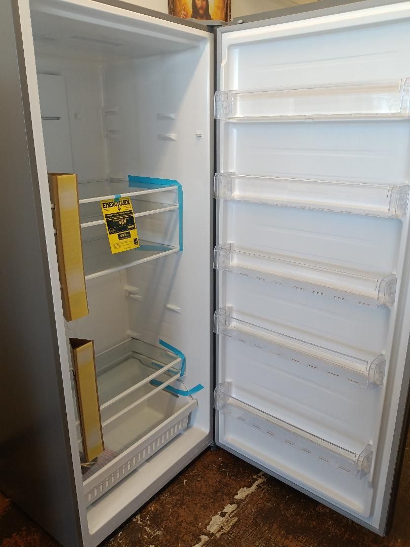 inside of a stainless steel upright freezer