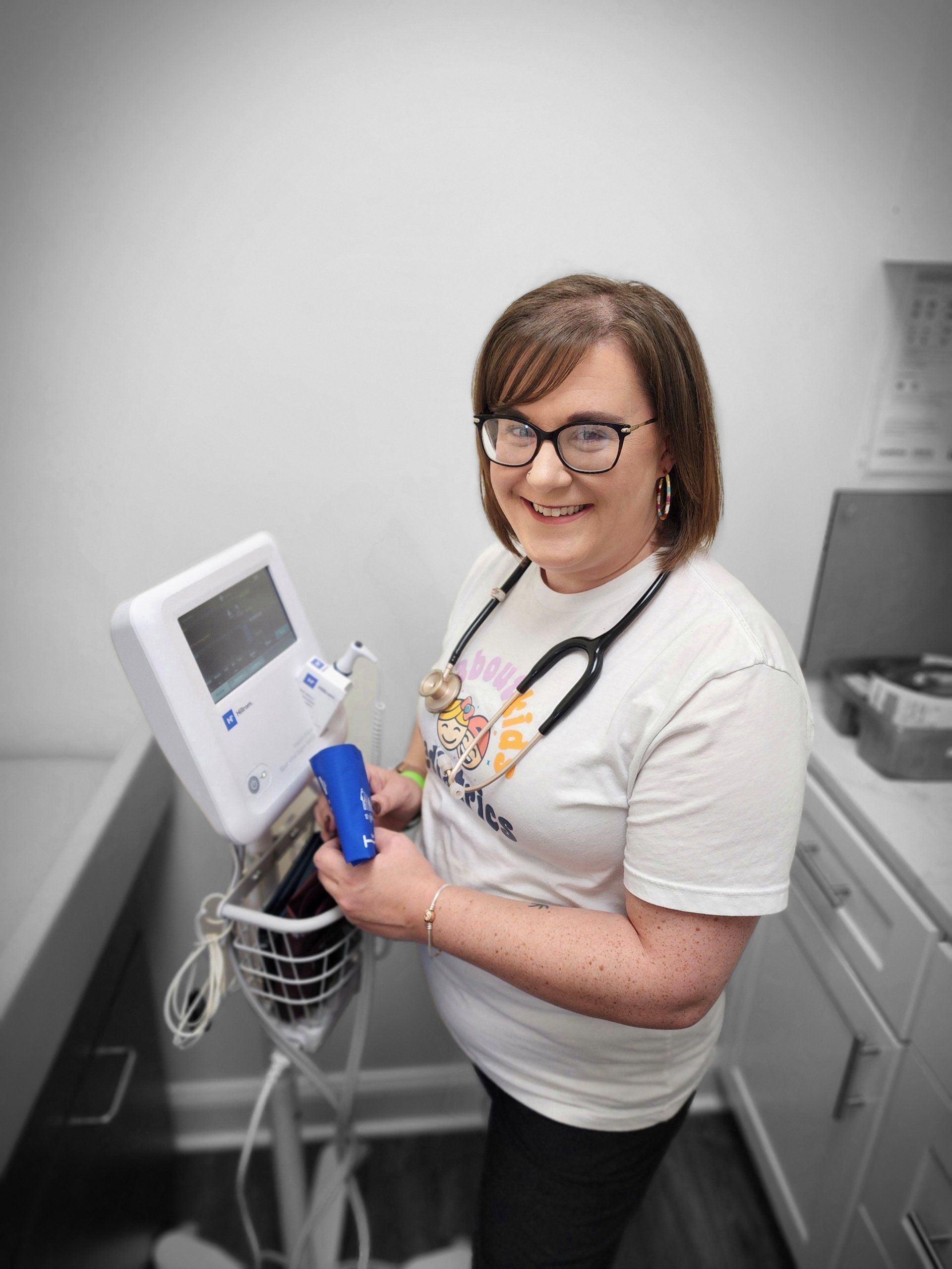 jen in front of vitals machine