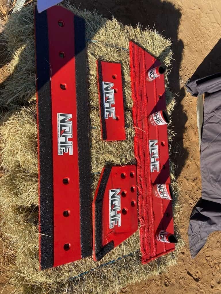 A Bunch of Red Pieces of Metal — North Queensland Hard Facing (NQHF) In Fredericksfield, QLD