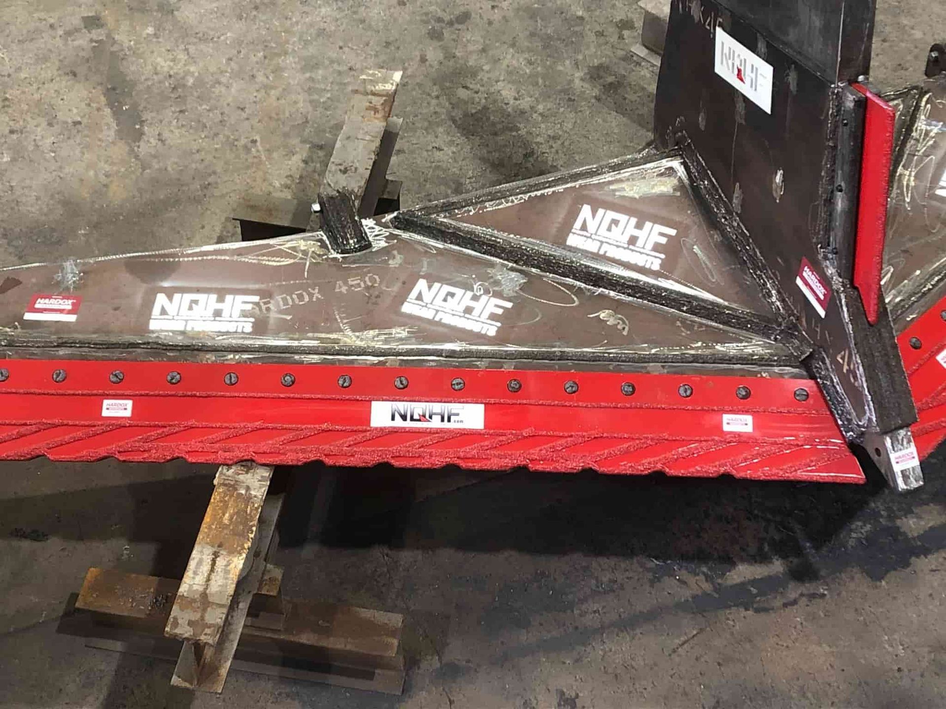 A piece of metal with the word niche on it — North Queensland Hard Facing (NQHF) In Mackay, QLD