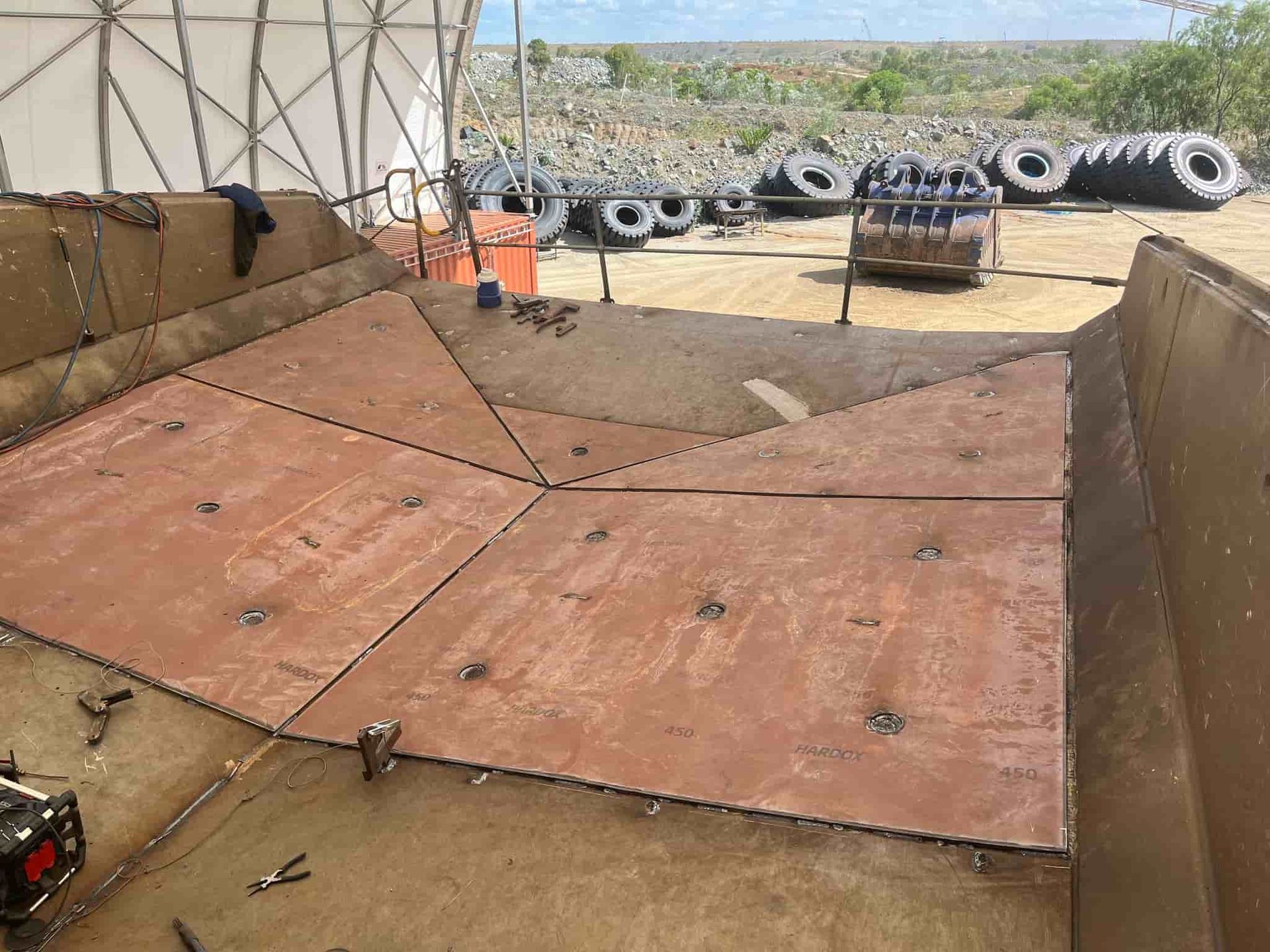 A Large Piece of Wood is Sitting on Top of a Dirt Field — North Queensland Hard Facing (NQHF) In Fredericksfield, QLD